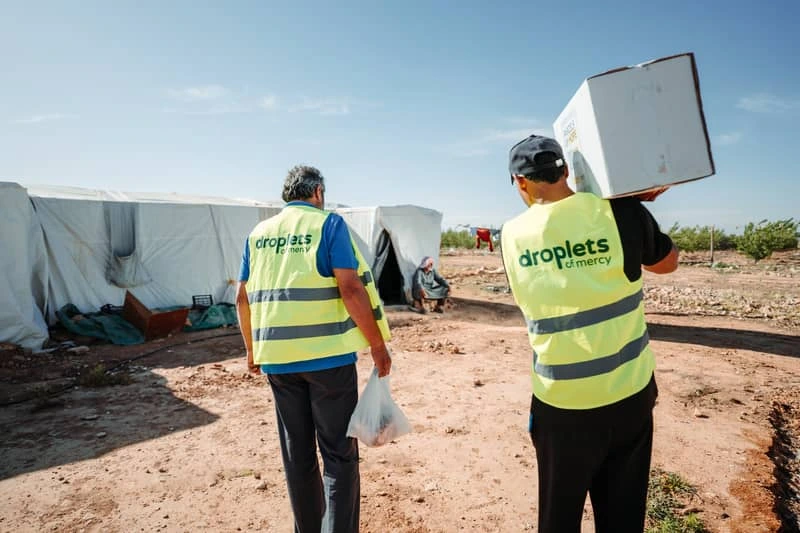 Droplets of Mercy volunteers delivering aid