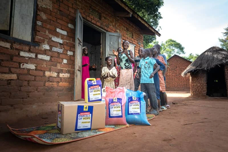 Family receiving food parcels in Uganda